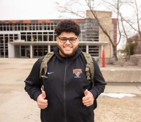 Student giving two thumbs up