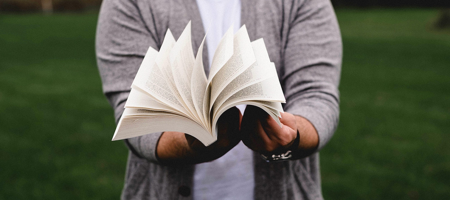 Student fanning a book open