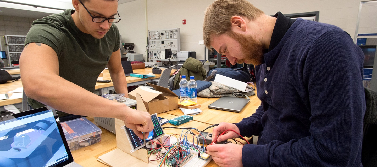 Students working on smart grid in lab