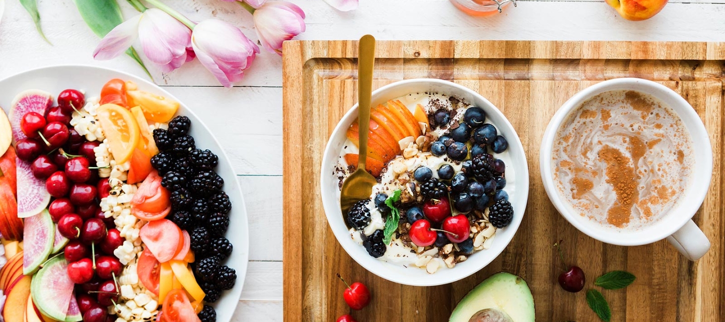 Fruit and food on a cutting board and plate